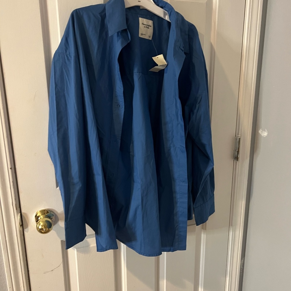 Brand New with tags Abercrombie& Fitch Blue lady's shirt in size Large.